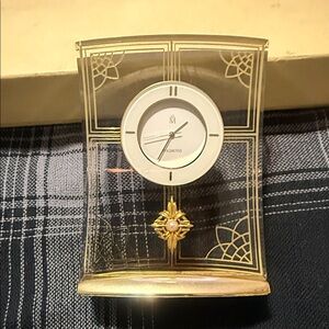 vintage Mikimoto desk clock featuring a decorative Akoya pearl.